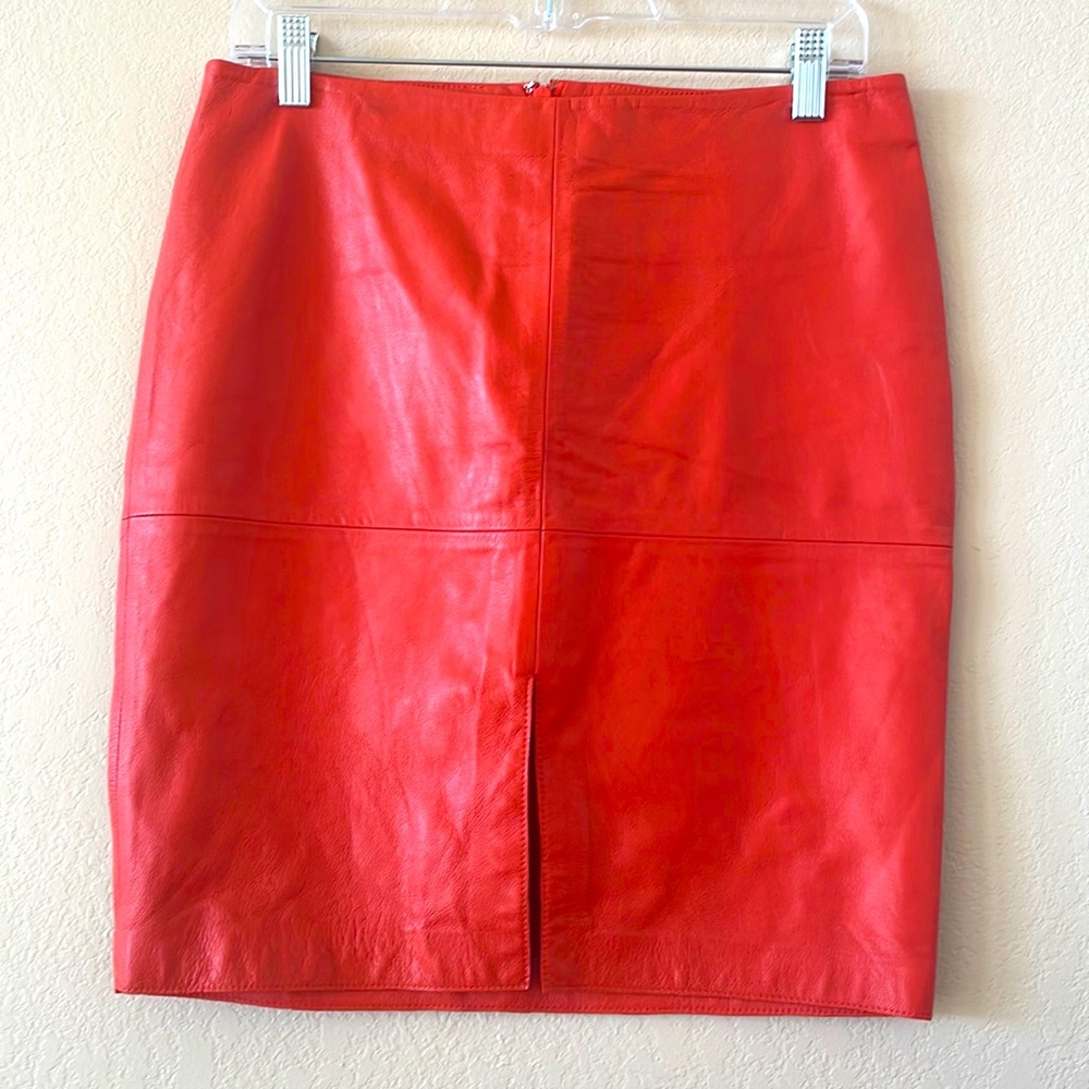 100% Lamb leather orange skirt. Size 4